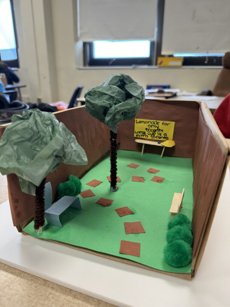 Completed pocket park design featuring a walking path, lounge area, and lemonade stand